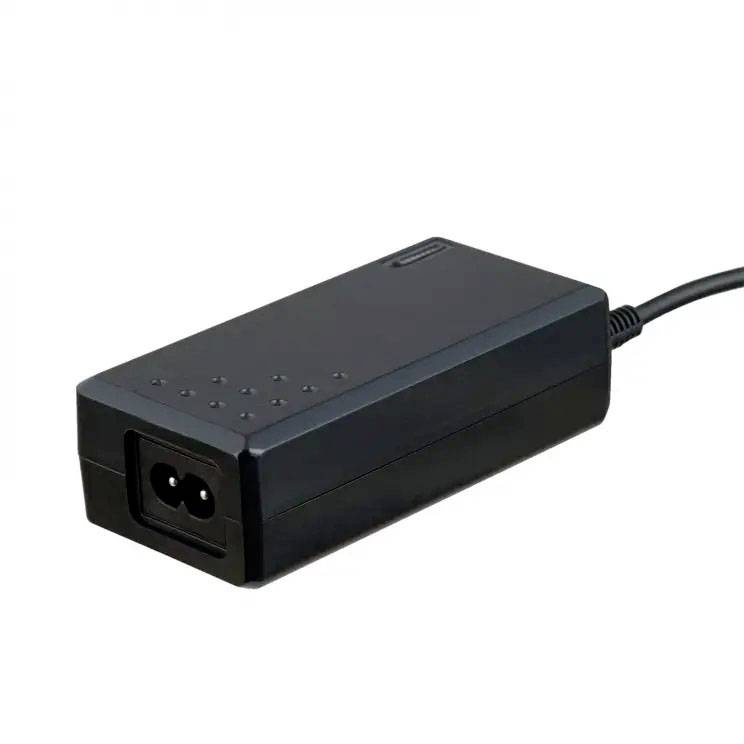 A black laptop power adapter with a rectangular shape and connection point for the laptop charging cable.