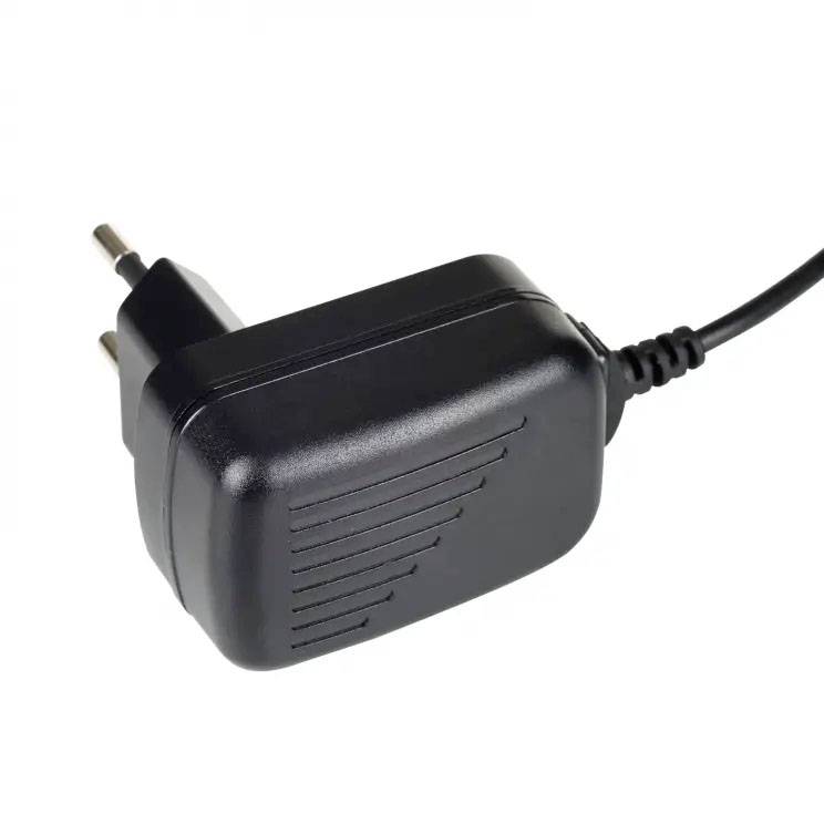 Black power adapter with cable connection, suitable for European power sockets.