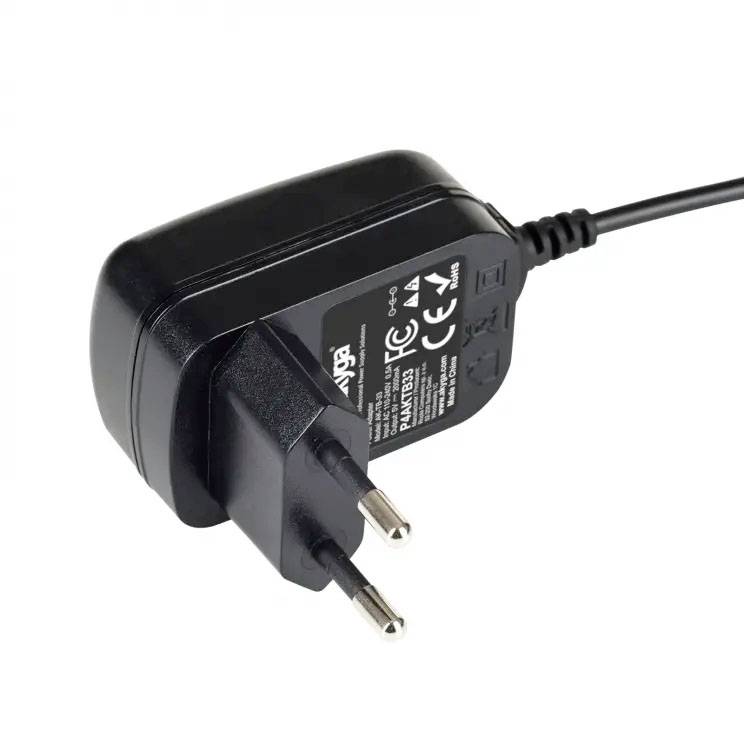 A black power adapter with EU plug, used for electronic devices. Shows markings and technical details on the surface.