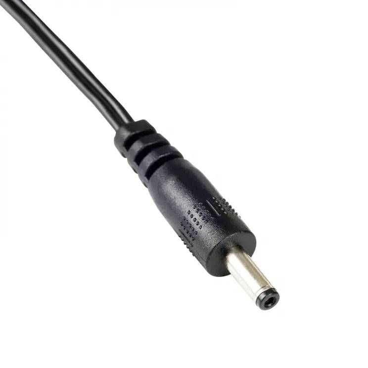 Black power adapter with cylindrical tip and cable. Used for connecting electronic devices to a power source.