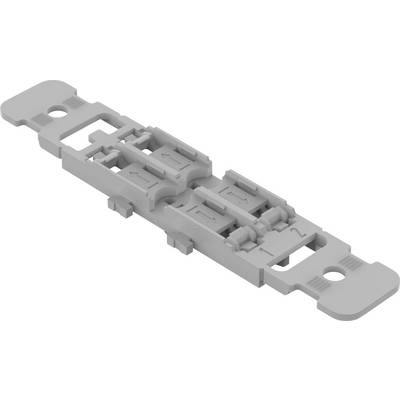 Grey plastic component showing a mechanical quick connector or adapter, with various notches and mounting points.