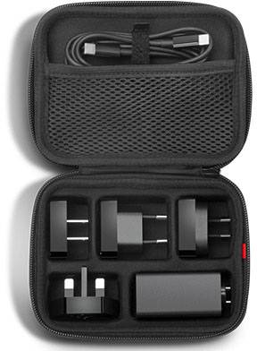 Black travel set with chargers and adapters in an open case, a cable in the mesh pocket at the top, with various plug types underneath.