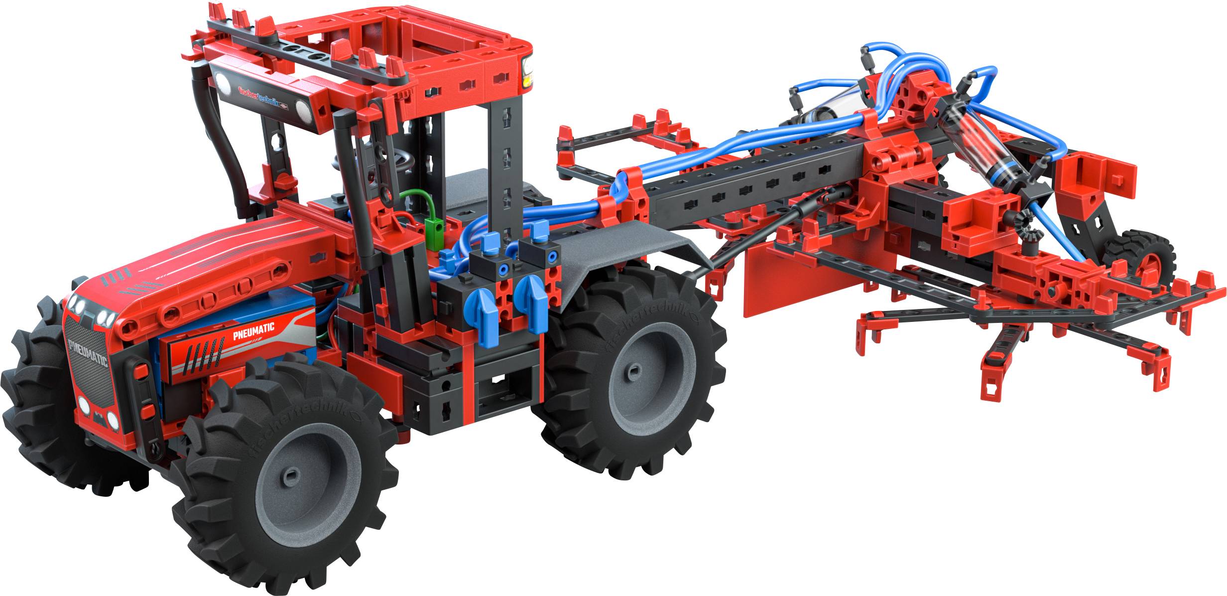A red tractor model made of building blocks with large black tyres and an agricultural implement attached to it.