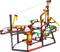 A colourful marble run made of interlocking components with loops and gradients. A marble rolls through the track.