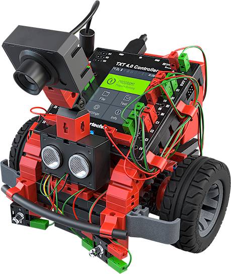 A small, red and black robot with wheels, a camera, and visible cables. The screen displays text and programme settings.