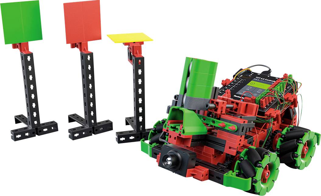 A robot-like model made of plastic with sensors and colourful components stands next to three coloured panels on stands.