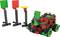 A learning robot from a construction kit approaches three traffic lights with red, green, and yellow signals, which are used for programming training.