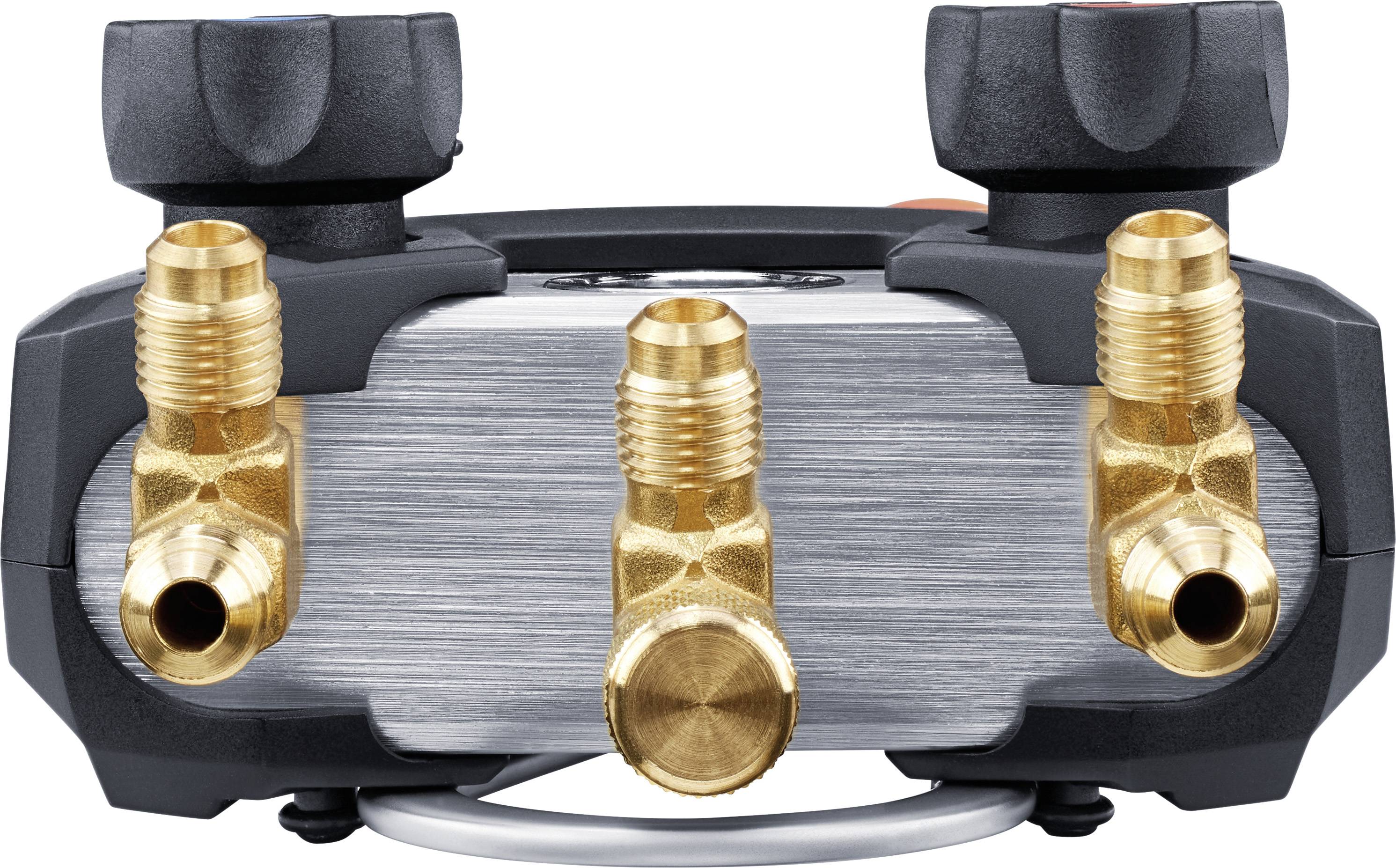 A metal valve block with three gold-coloured connections and two black handles. Valve control for liquids or gases.