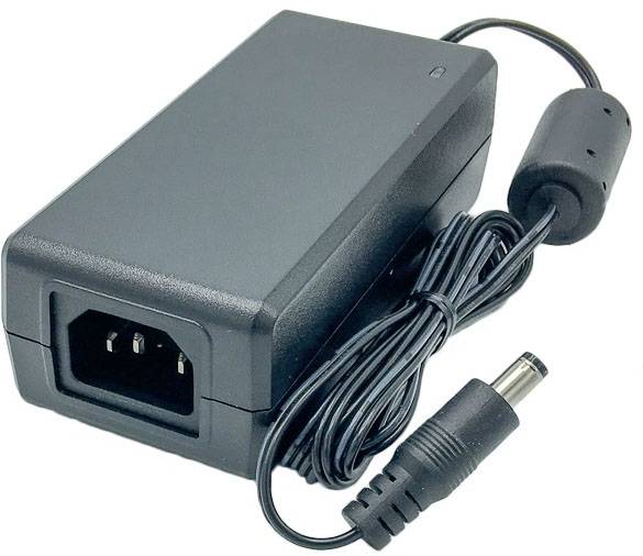 Power supply with a detachable mains cable, black casing, one socket for power input and a plug for electrical devices.