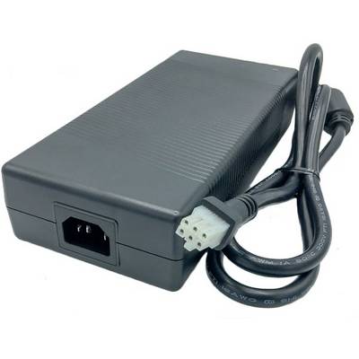 Black power supply with a detachable power cable, three-pin plug, and a ventilation opening, suitable for electronic devices.