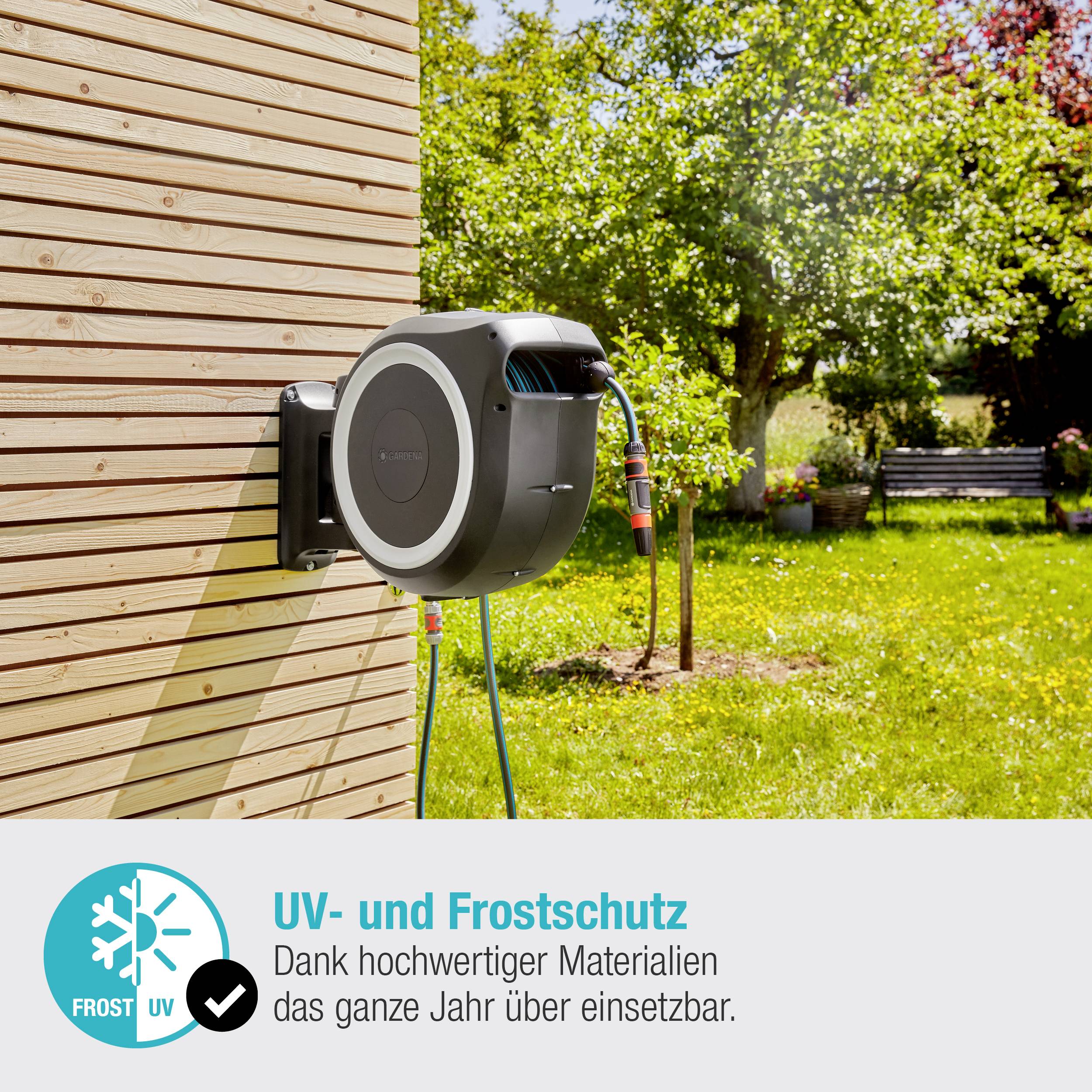Garden hose reel mounted on a wooden wall in the garden, with labelled text field: 'UV and frost protection thanks to high-quality materials'.