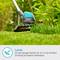 A lawn trimmer cuts grass in a garden. Text: 'Light. A very low weight of just 2.4 kg prevents fatigue during prolonged work.'