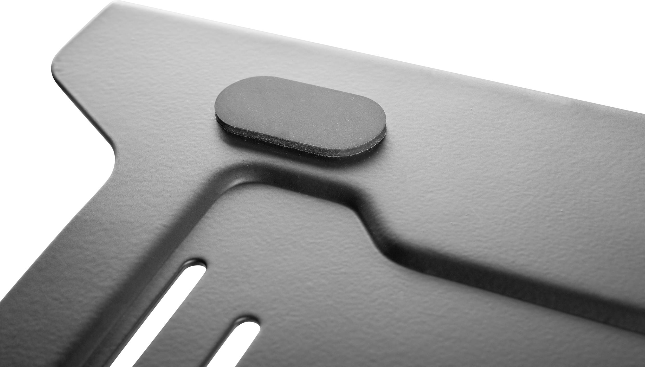 Close-up of a grey metal surface with an oval protrusion. The structure appears industrial and plain.