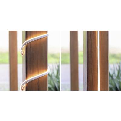 Wooden post with LED lighting: left-wrapped LED strip, right vertical LED line. Surrounded by blurred green.