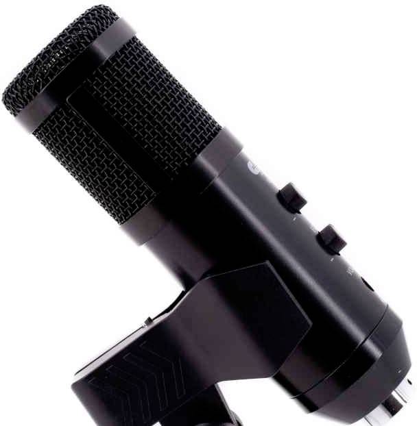 A black microphone with a mesh capsule, side controls and a stand. Suitable for sound recordings or broadcasts.