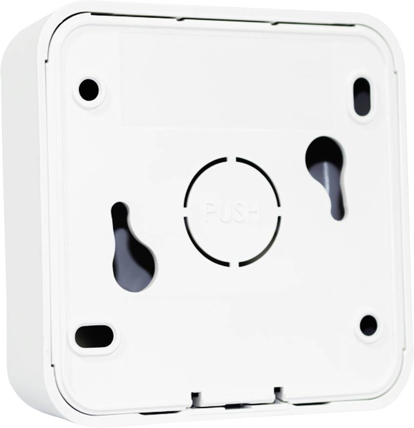 Back of a white, square device with 'PUSH' written on it. Visible wall-mounting holes at the corners.