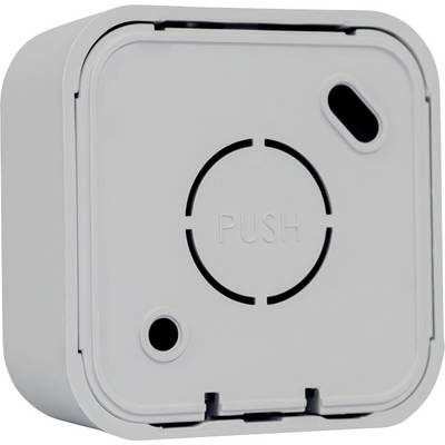 A square, white plastic device with the inscription 'PUSH', a circular symbol, and an oval opening.