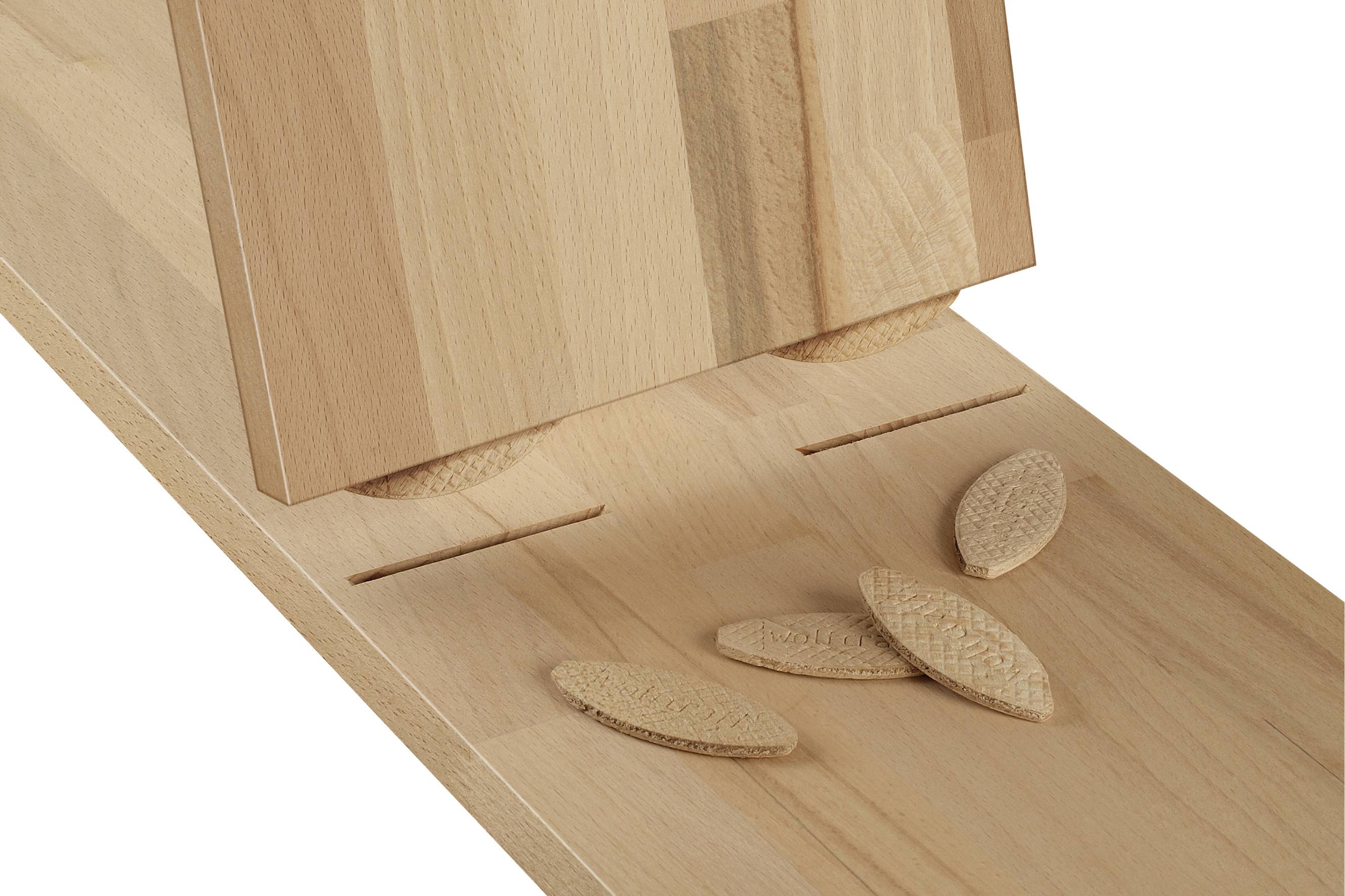 Wooden joint with flat round wooden dowels; two wooden boards are connected by the dowels, with some dowels lying beside them.