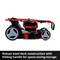 'Red, folding lawnmower with robust steel frame for space-saving storage.'