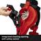 A hand turns the safety lock of a red leaf blower to reveal the cleaning opening. Text: 'Integrated cleaning opening with safety switch'.