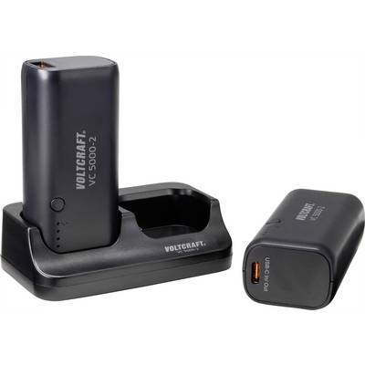 Two black Voltcraft chargers, model VC 5000-2. One is standing upright in the charging station, the other lying beside it.
