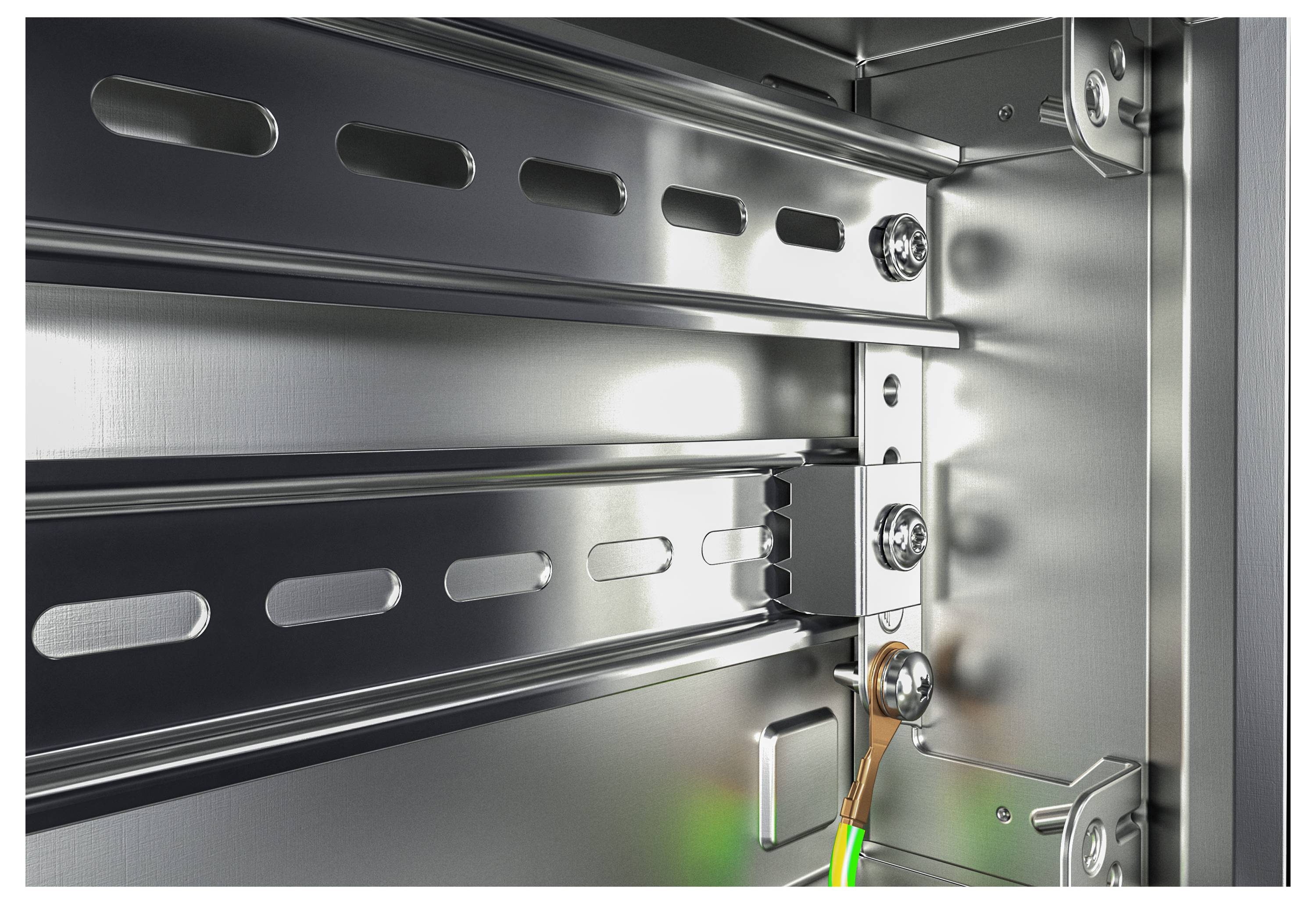 Interior of a metallic electrical cabinet with an earthing rail. Cable is connected to an earthing terminal.