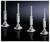 Four silver machine feet with screw spindles against a dark background, arranged symmetrically. Suitable for industrial applications.