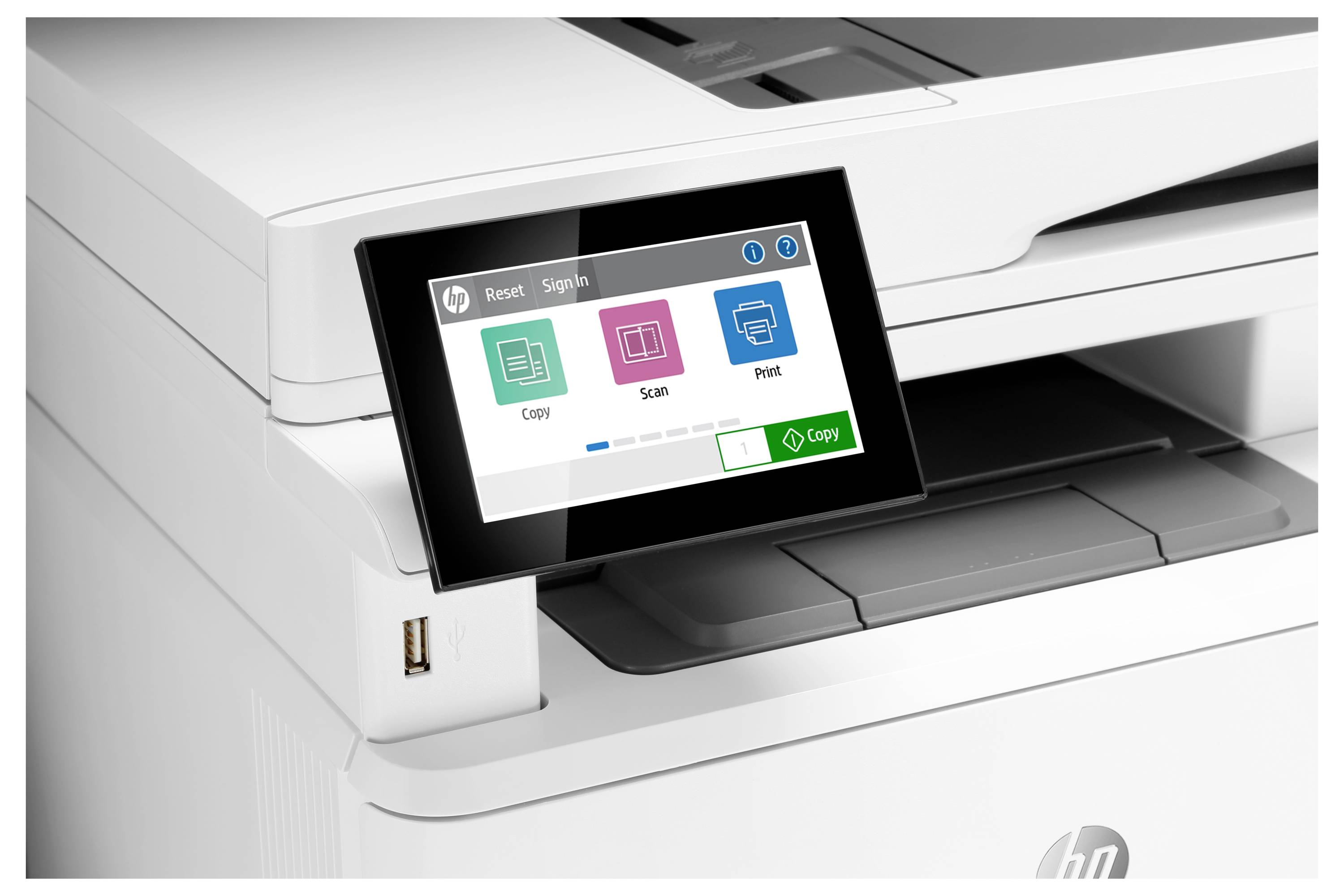 Close-up of an HP all-in-one printer control panel showing touch buttons for Copy, Scan, and Print, with a green Copy action button visible.