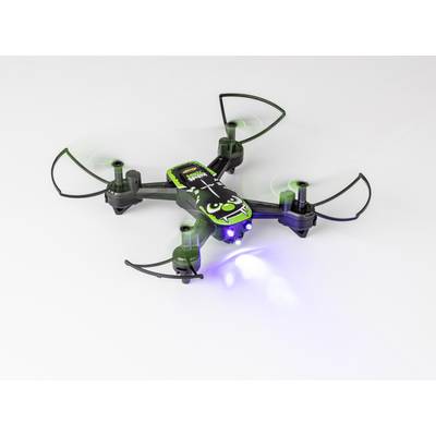 A small, black and green quadcopter drone hovers in the air. It has a stylised grimacing face on its top surface.