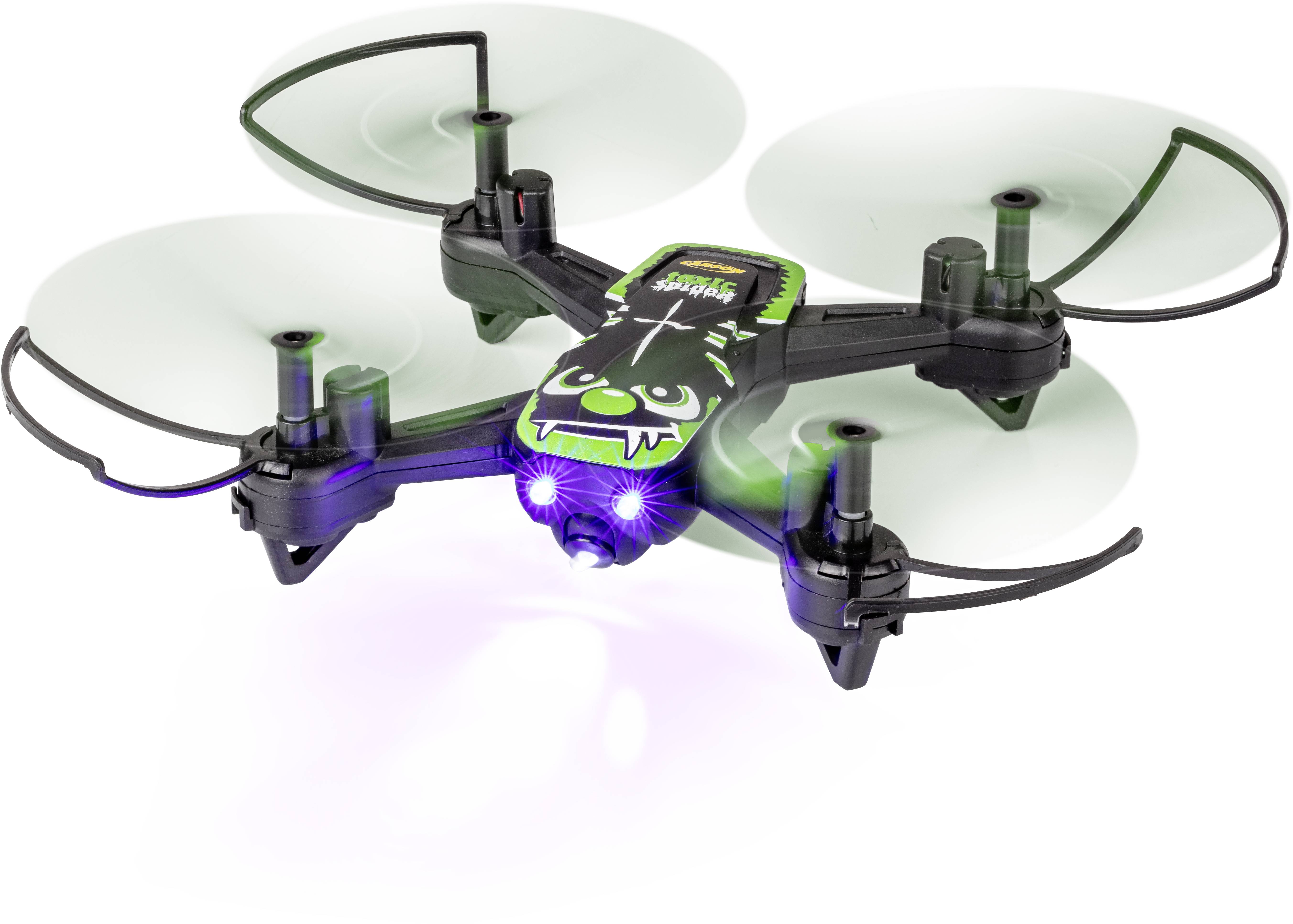 A black and green quadcopter drone hovers. It has a face-like design on the top surface and illuminated lights at the front.
