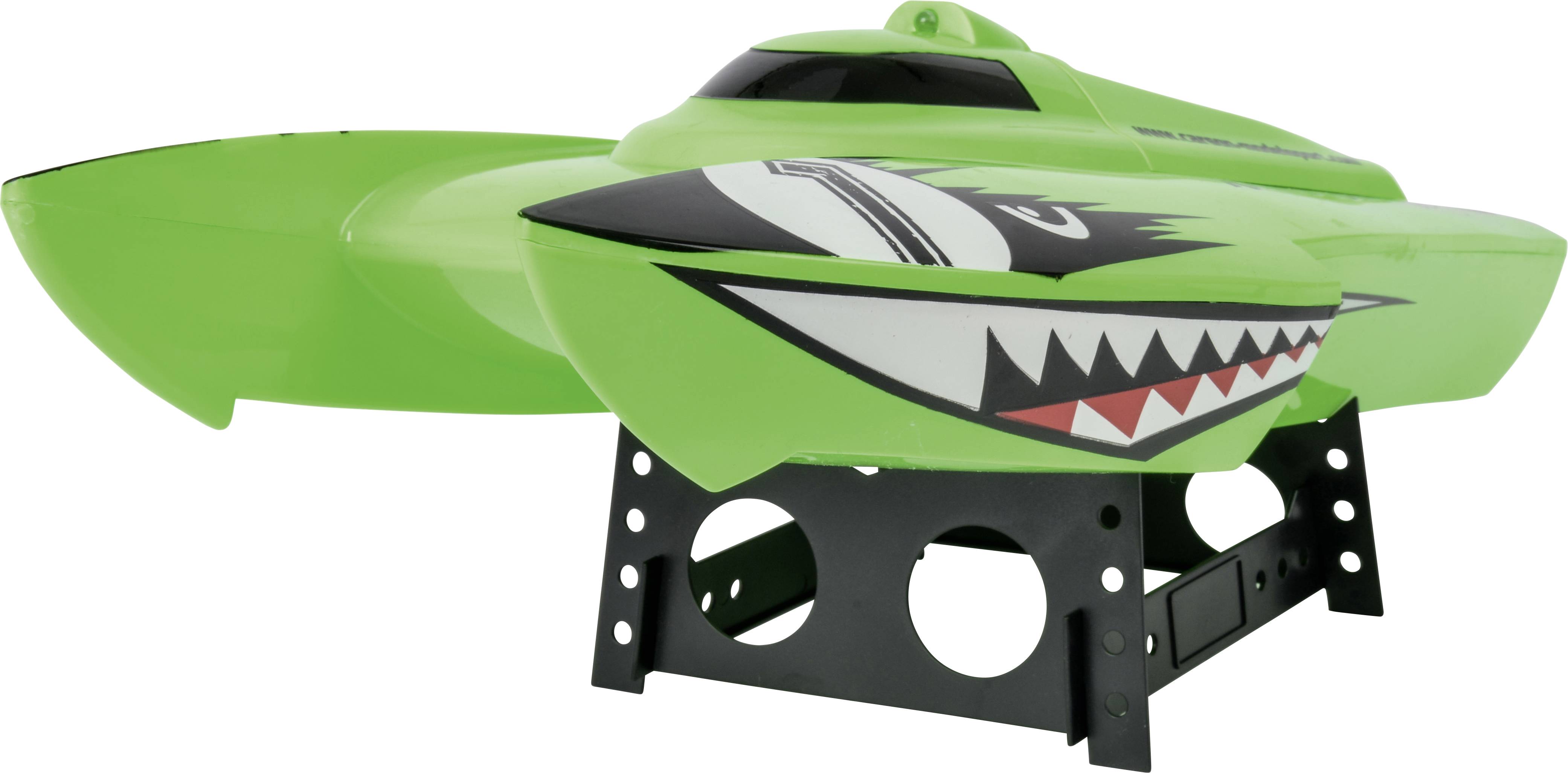 Green remote-controlled boat with shark design, standing on a black stand.