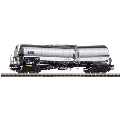A silver tank wagon from the GATX company on railway tracks, with hazardous goods markings and technical details on the side.