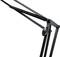 A black lamp arm with joints and a spring, providing flexibility and adaptability, can be seen.