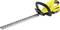 A yellow, cordless hedge trimmer with a long, serrated cutting blade, ergonomic handle, and rechargeable battery.