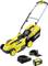 Yellow battery-powered lawn mower by Kärcher with battery, charger and grass collection box. Model with 45-litre collection capacity, suitable for home and garden use.