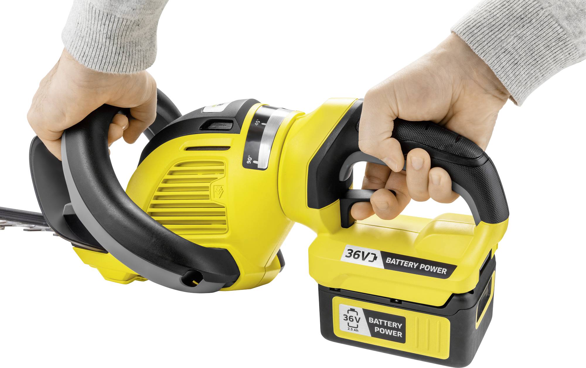 Two hands are holding a yellow, cordless electric chainsaw with a 36V battery.