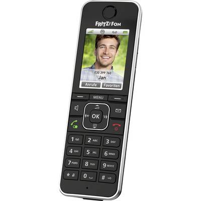 Cordless telephone with display showing a portrait photo of a smiling man, named 'Jan', and his telephone number. Keypad below.