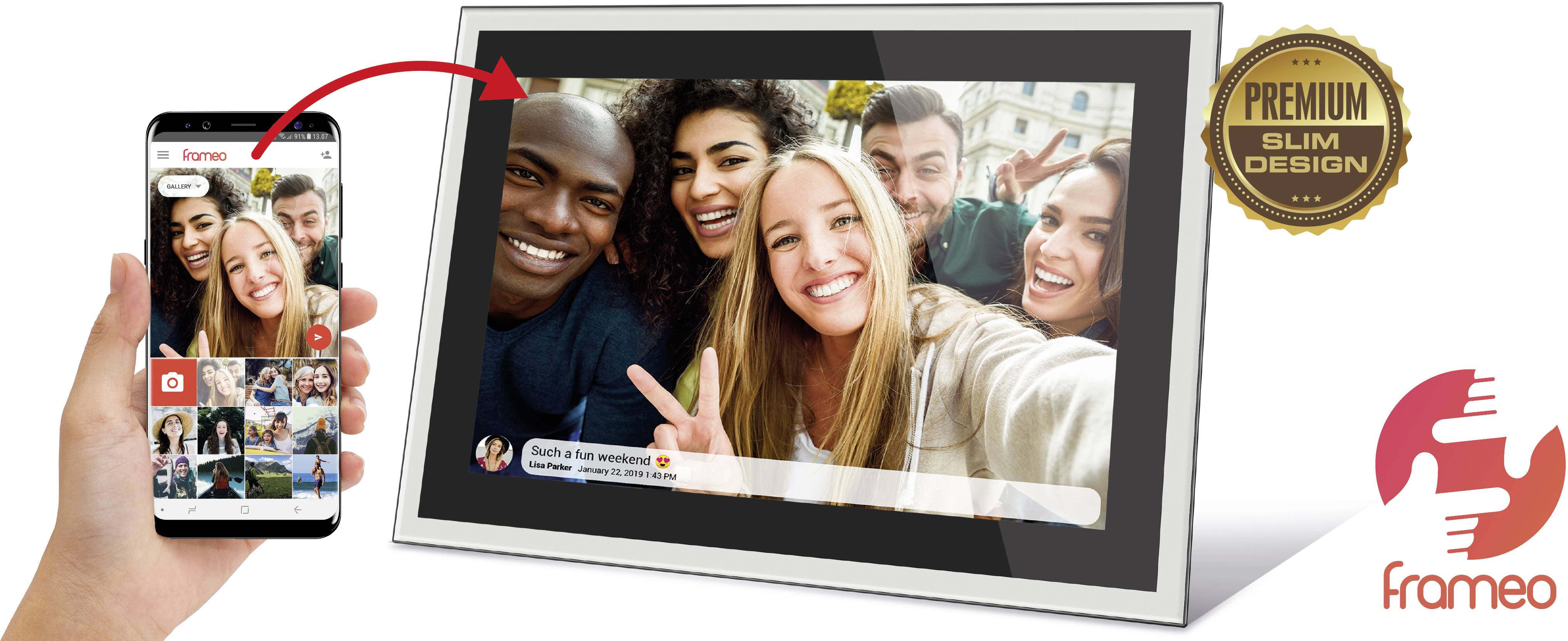 A hand is holding a smartphone with the Frameo app. To the right, a digital photo frame displays a group selfie.