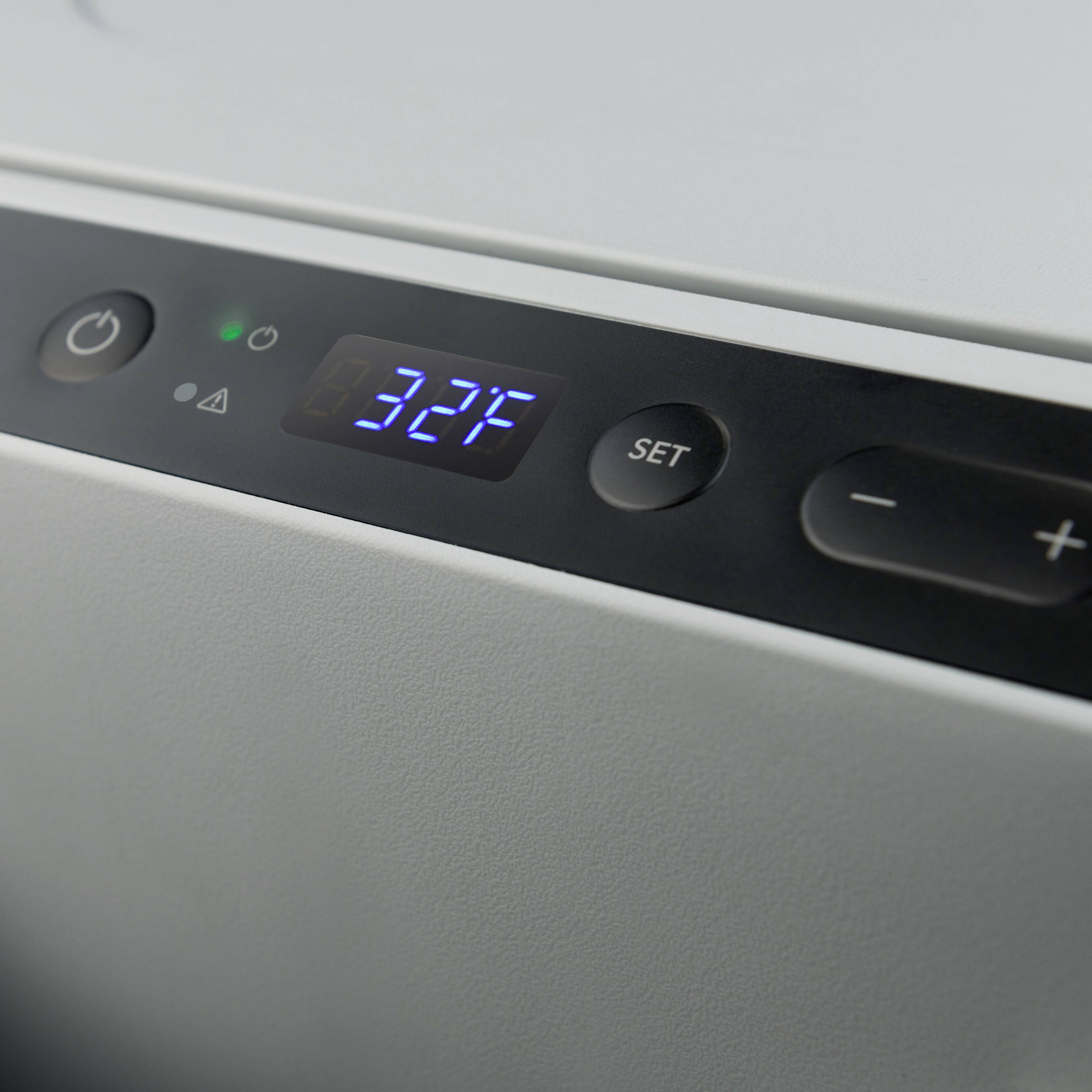 Digital thermostat display showing '32°C'. Temperature adjustment buttons are located beside it.