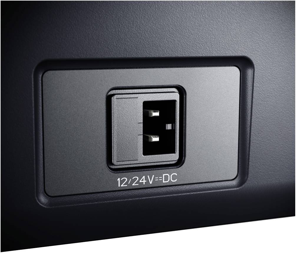 A DC power socket with the marking '12/24V=DC' in a rectangular frame on a black device.