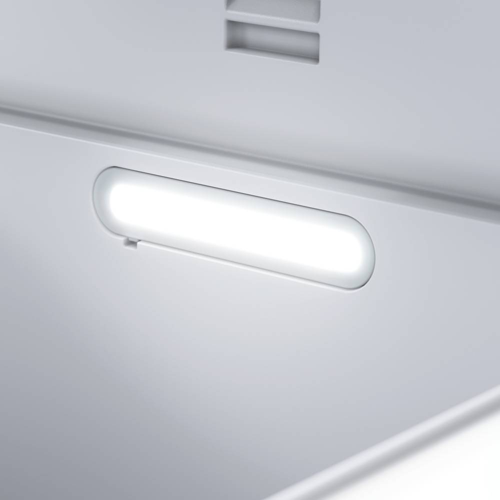 A brightly illuminated, rectangular LED strip is positioned on the wall of a minimalist environment.