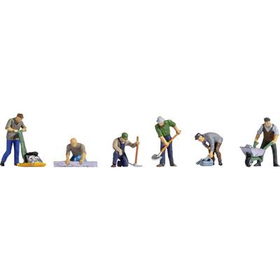 Six miniature figures are carrying out construction work: laying paving stones, levelling ground, mixing concrete, digging, pushing wheelbarrows, shovelling.