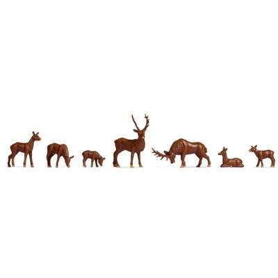 A series of wildlife figures: two standing deer, a feeding deer, a stag with large antlers, a reclining deer and another stag.