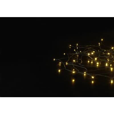 A string of fairy lights with warm yellow LEDs lies on a dark background, spreading a soft, inviting light.