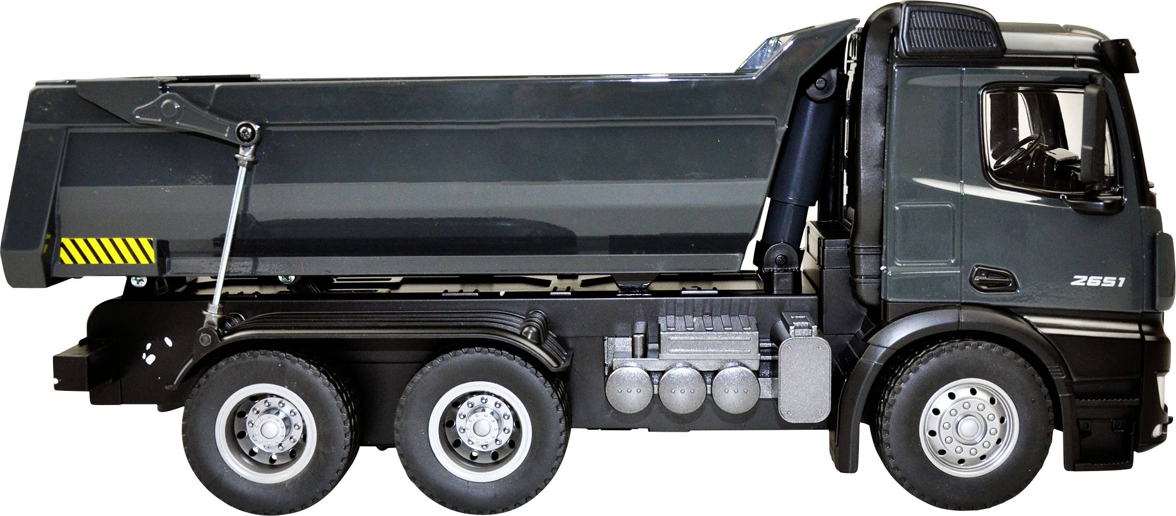 A tipper lorry in side profile. The HGV has six tyres and a dark paint finish.