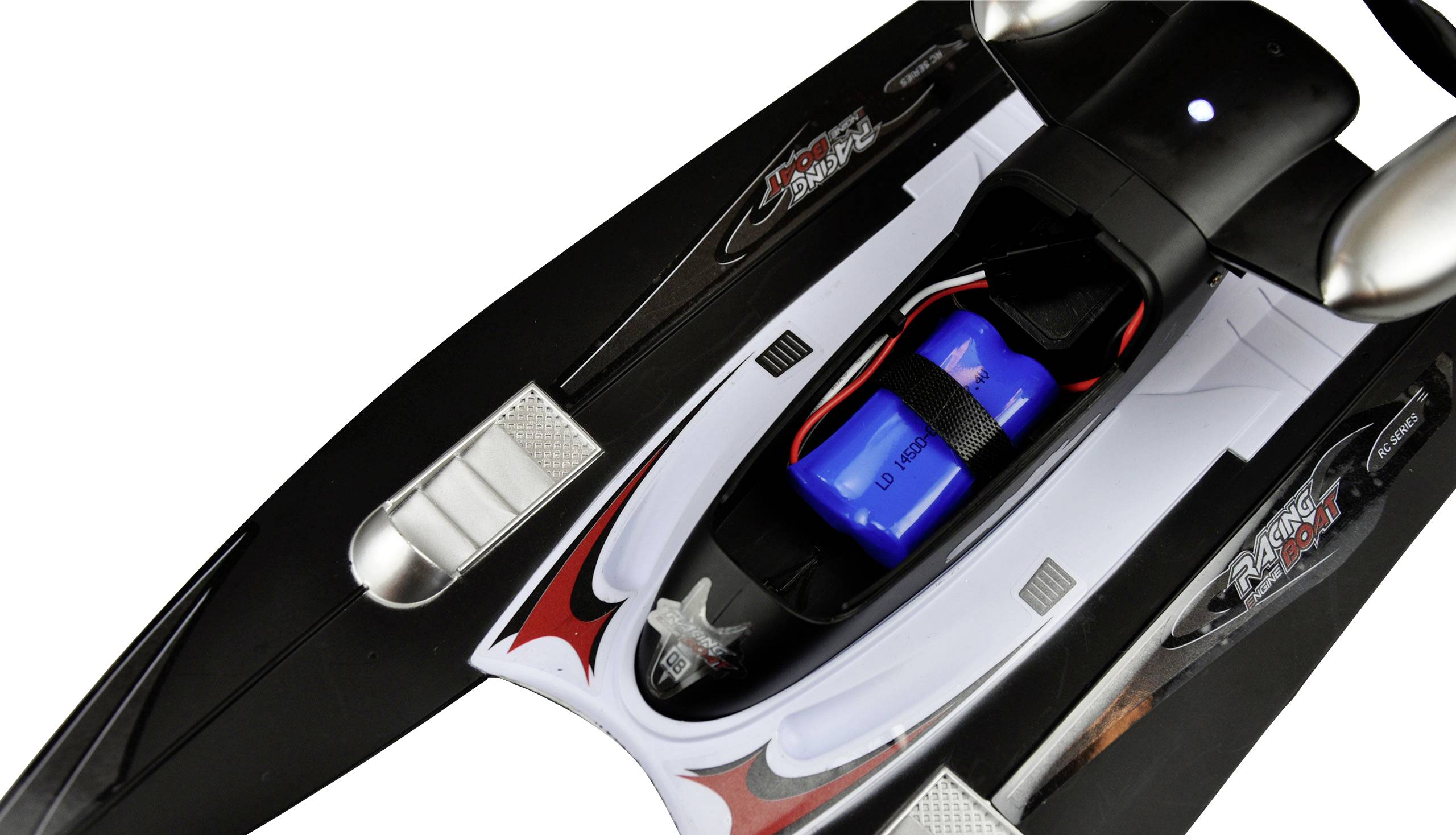 Black and red model speedboat with a blue battery on the top deck, showing parts of the engine cover and seats.