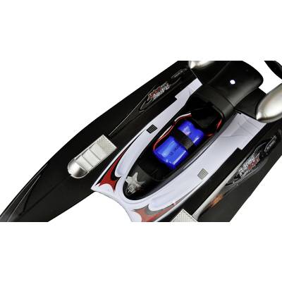 Black and red model speedboat with a blue battery on the top deck, showing parts of the engine cover and seats.