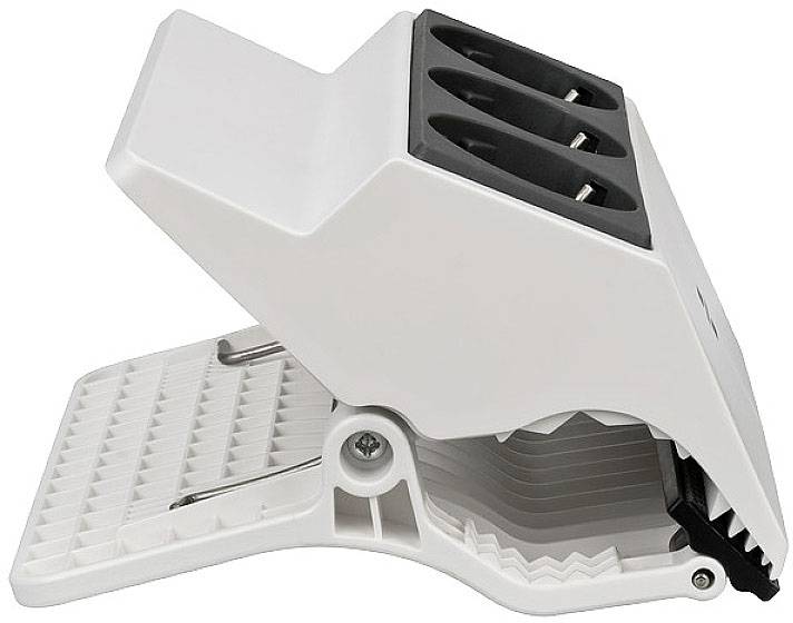 White, folding table socket adapter with three slots and ribbed underside.