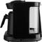 Black coffee machine with water level indicator, handle, and jug. Minimalist design, suitable for the kitchen.