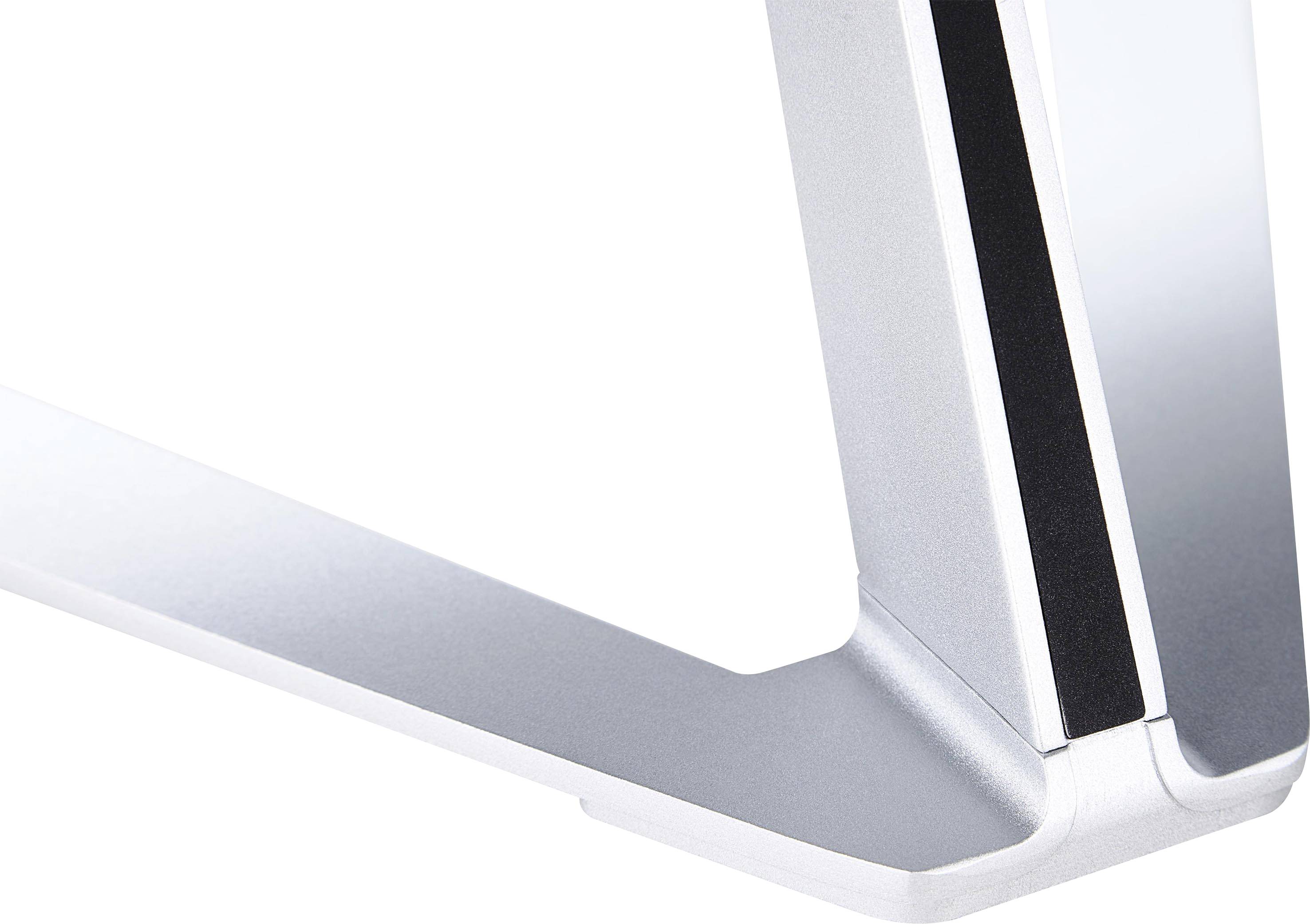 Close-up of a silver metal stand with a modern design and clean lines, potentially part of an electronic device or piece of furniture.